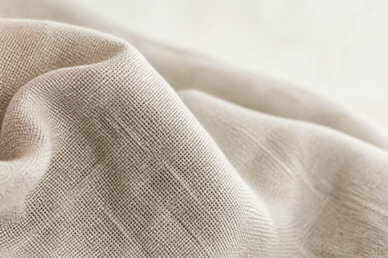Flax-coloured Belgian linen folded in soft creases